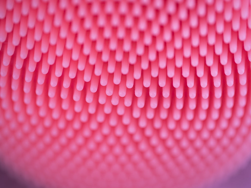 Cepillo sónico de silicón rosa para limpieza facial